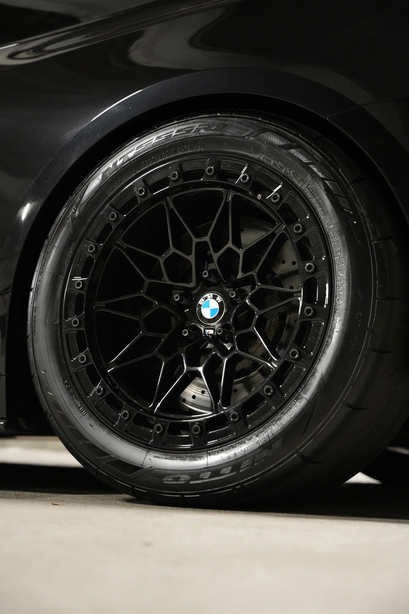 Close-up of a black Ryvik Forged wheel installed on a BMW