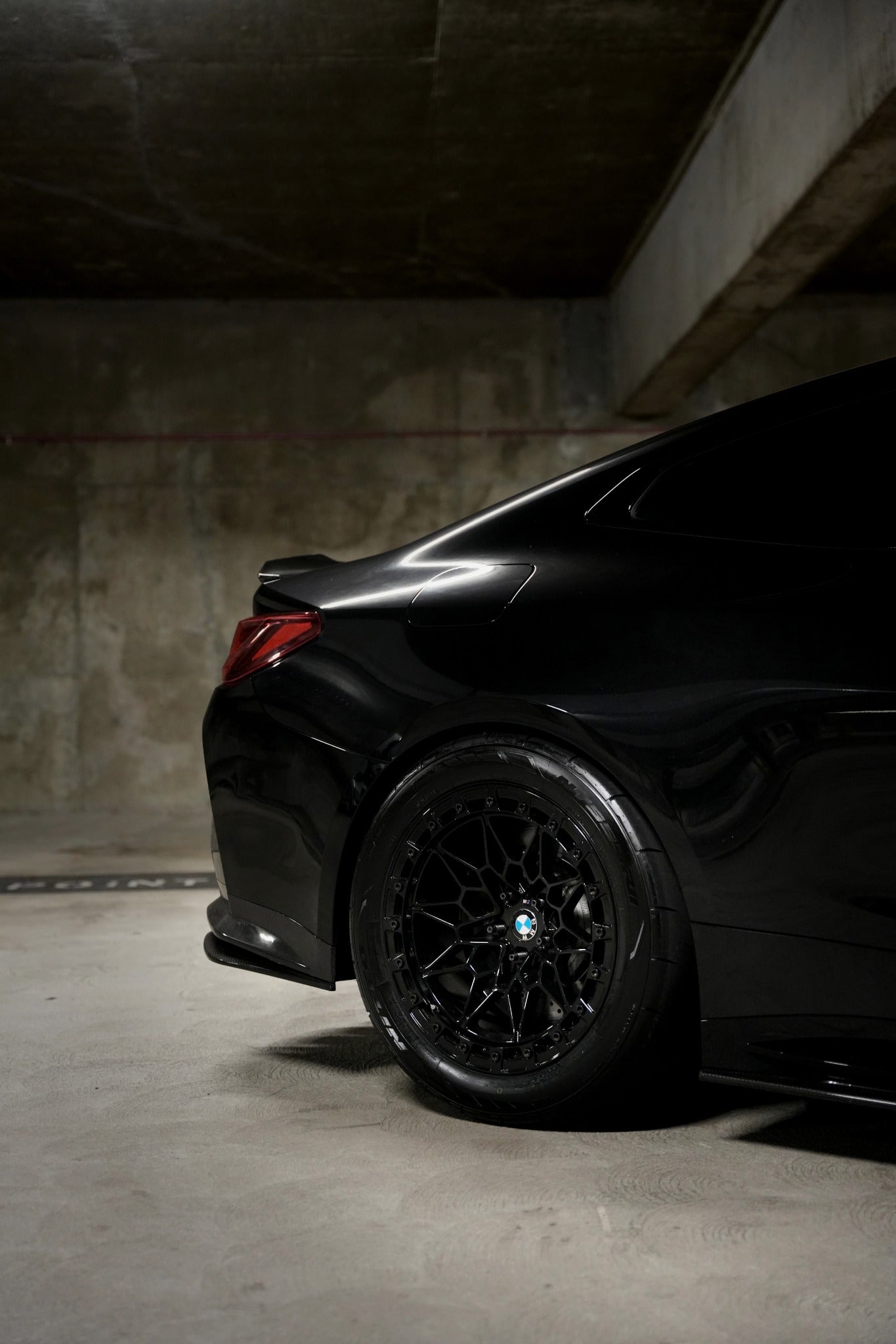 Rear-quarter view of a black BMW fitted with Ryvik Forged wheels